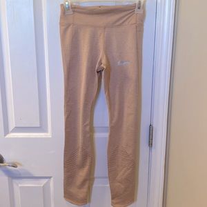 light pink Nike sports and running leggings